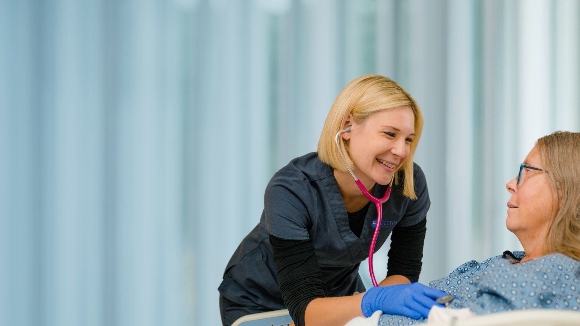 neuroscience nurse taking care of patient