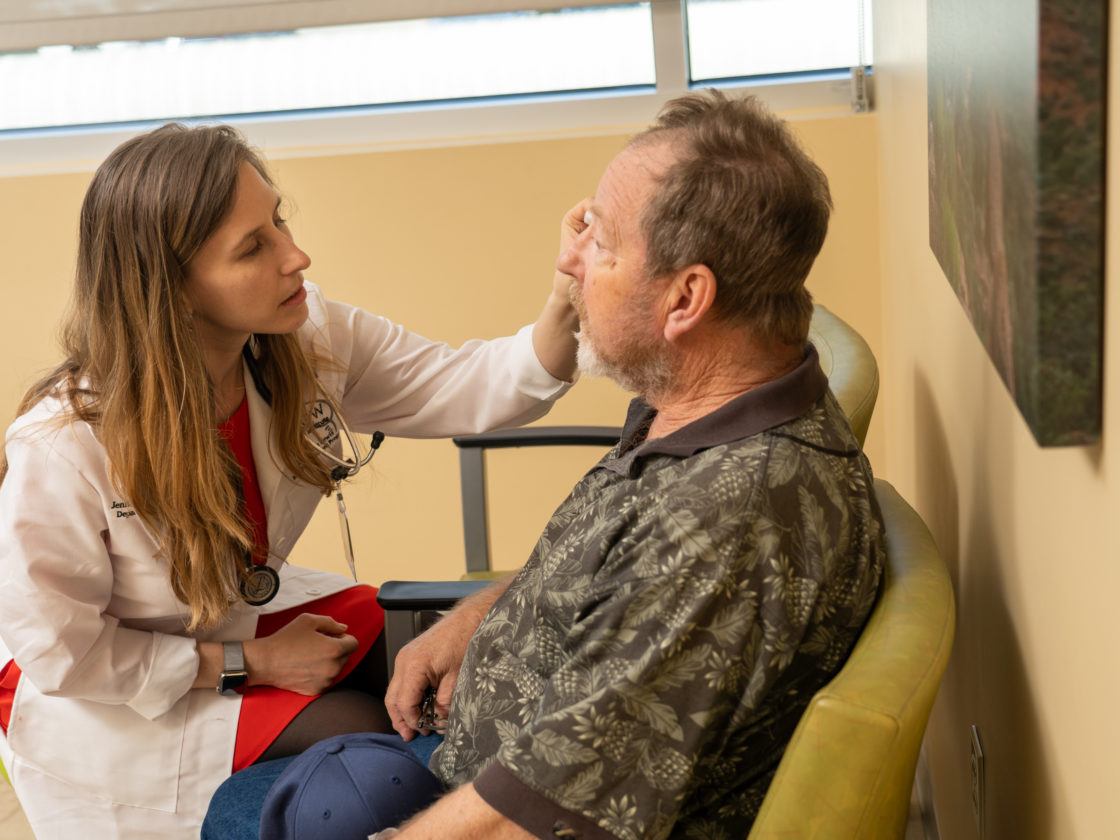 Dr. Robblee tends to a patient in the clinic