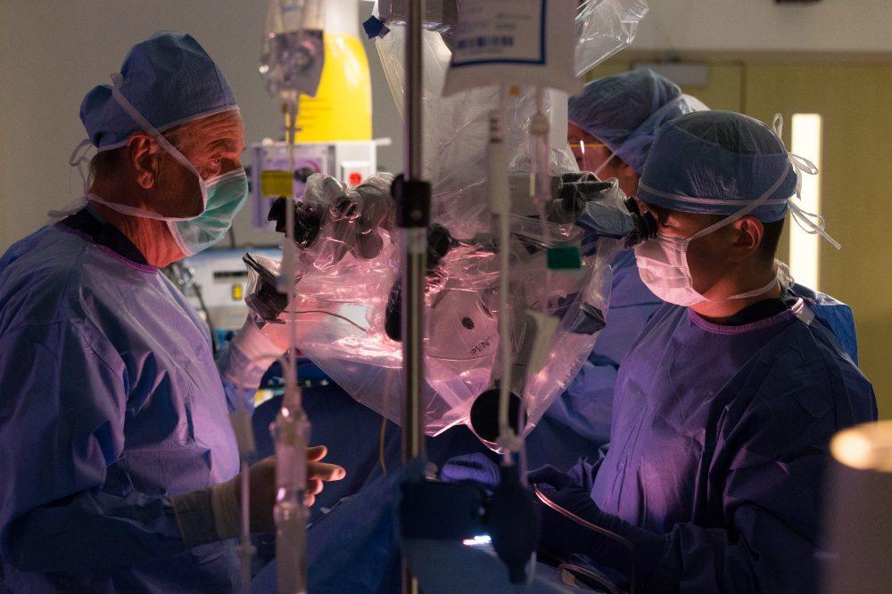 Neurosurgeon Dr. Robert Spetzler operating with resident Dr. Karam Moon