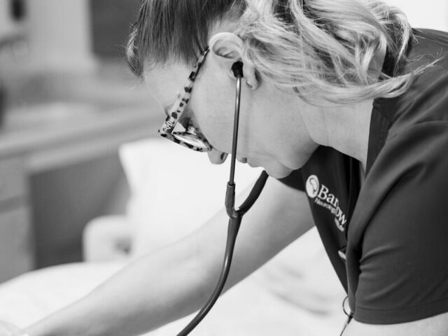 Barrow nurse treating a patient