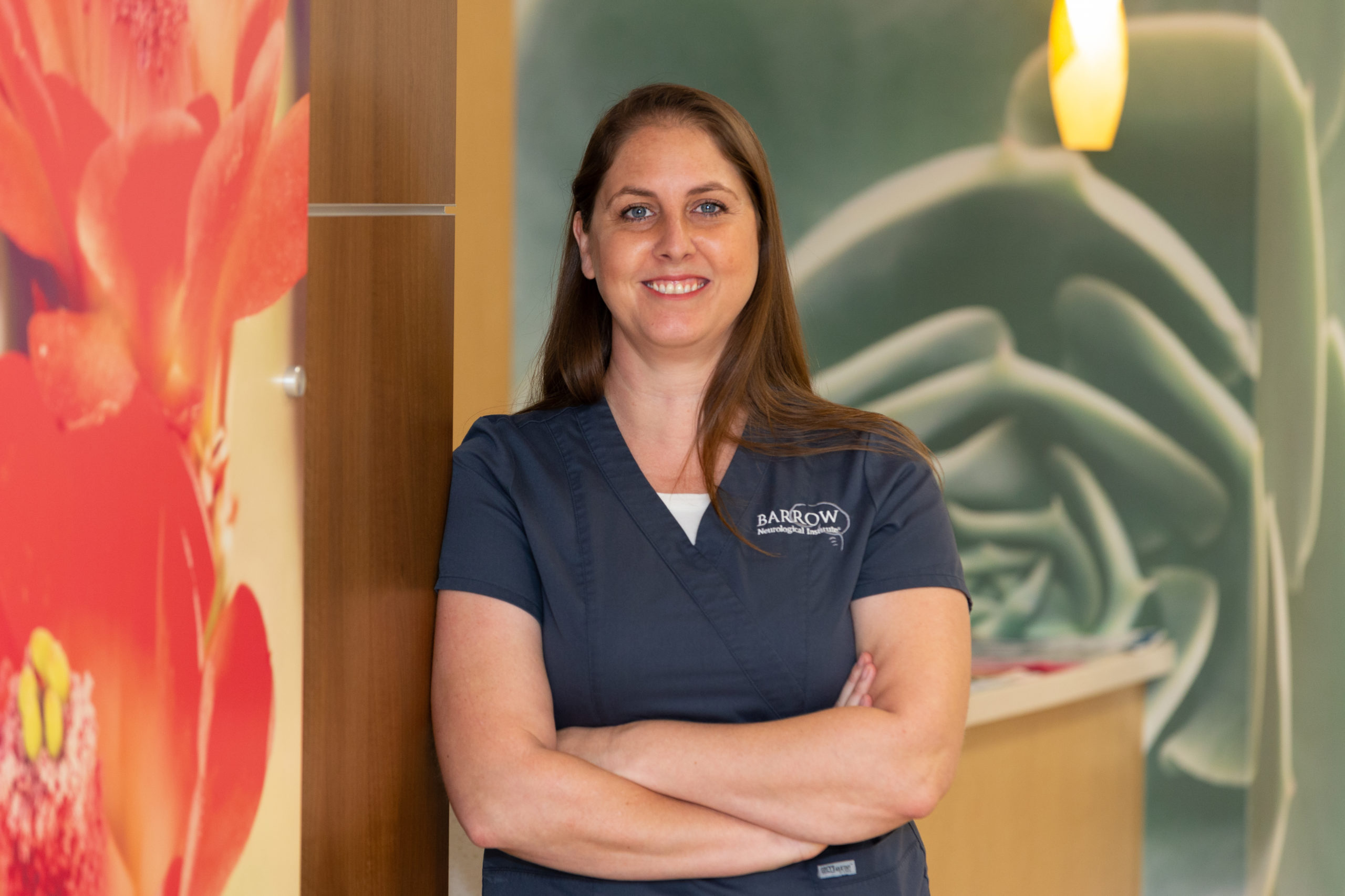 Portrait of Jacki Garcia, neurosurgical oncology nurse navigator, in the hallway at Barrow Neurological Institute