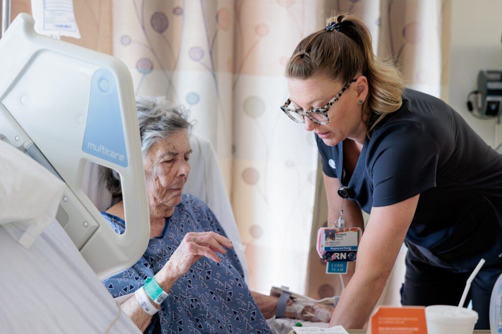 a barrow neuroscience nurse caring for a patient in the neuro intensive care unit