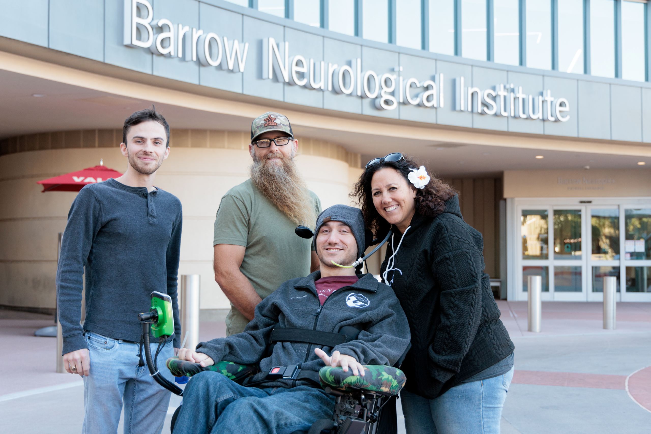 Noland Arbaugh with his family in front of the Neuroplex at Barrow Neurological Institute
