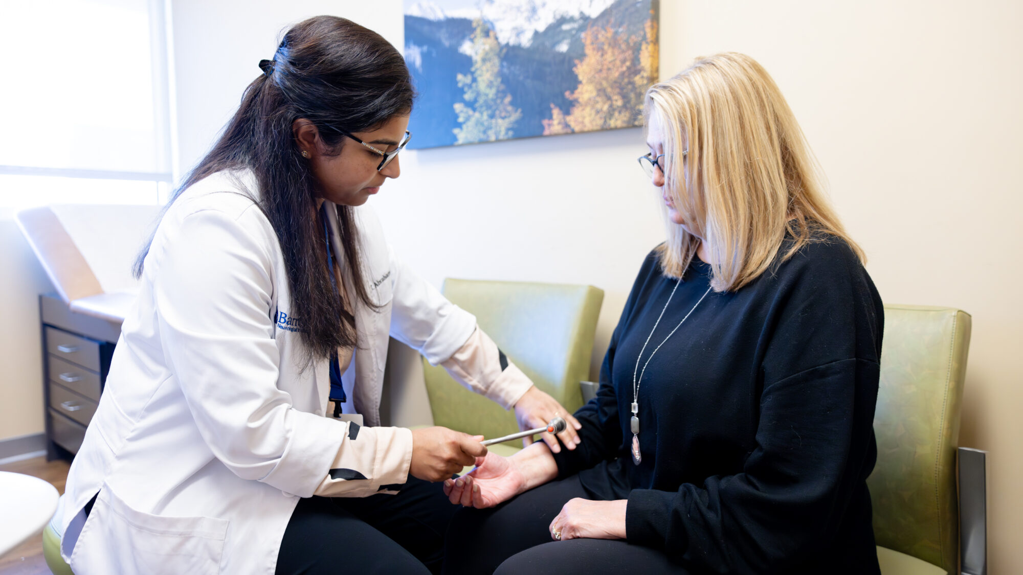 multiple sclerosis specialist rinu abraham examines a patient at barrow neurological institute