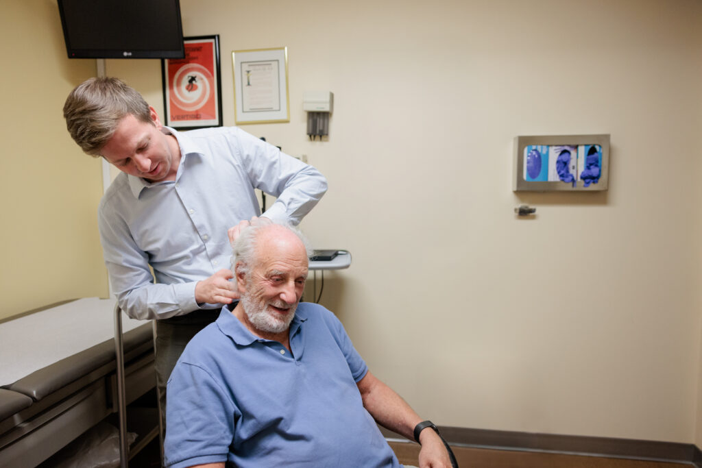 neuro-otologist justin hoskin examines a patient at barrow neurological institute