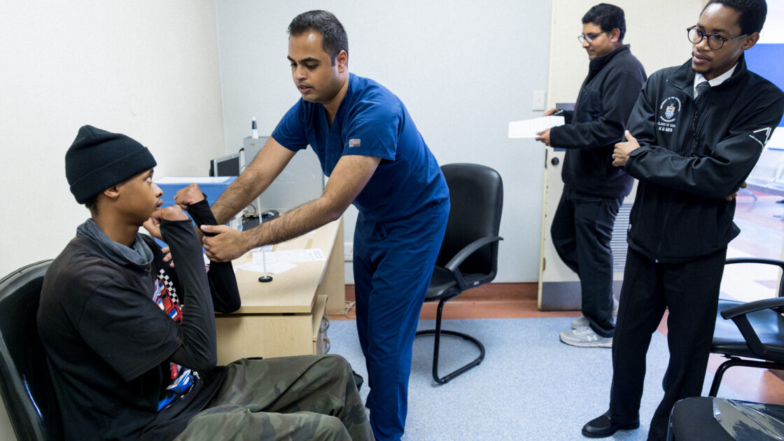 Dr. Dantu examines patient in the teaching clinic at Baragwanath Academic Hospital.