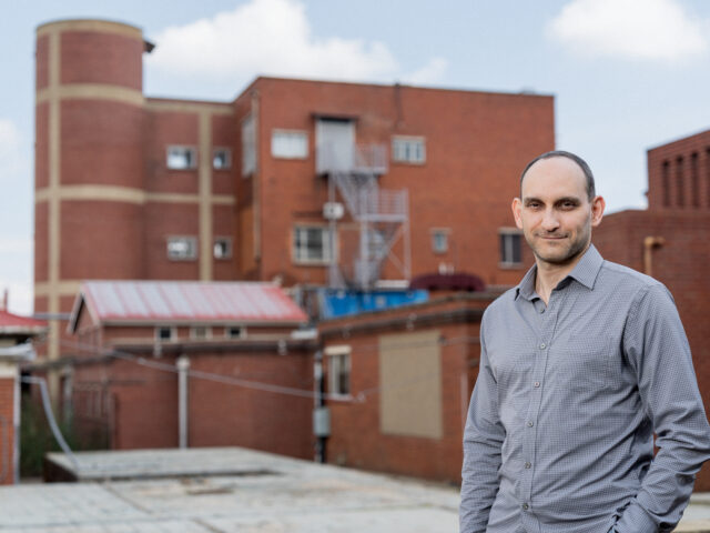Dr. Vladimir Shvarts standing outside of Chris Hani Baragwanath Hospital during his first visit to Johannesburg, South Africa with the Barrow Global Neurology team.