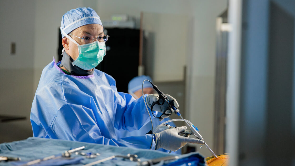 Dr. Uribe performing an endoscopic spine surgery in the operating room at Barrow.