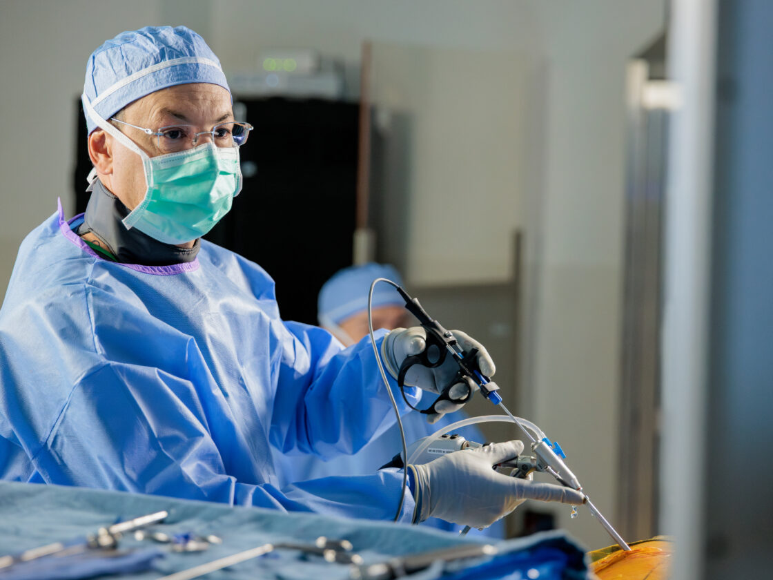 Dr. Uribe performing an endoscopic spine surgery in the operating room at Barrow.