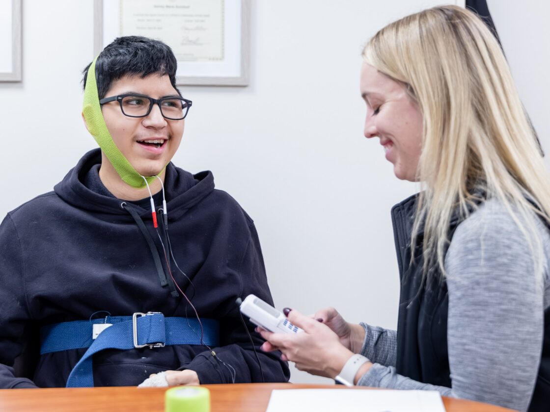 Barrow Neuro-Rehab patient receives therapy to begin swallowing again.