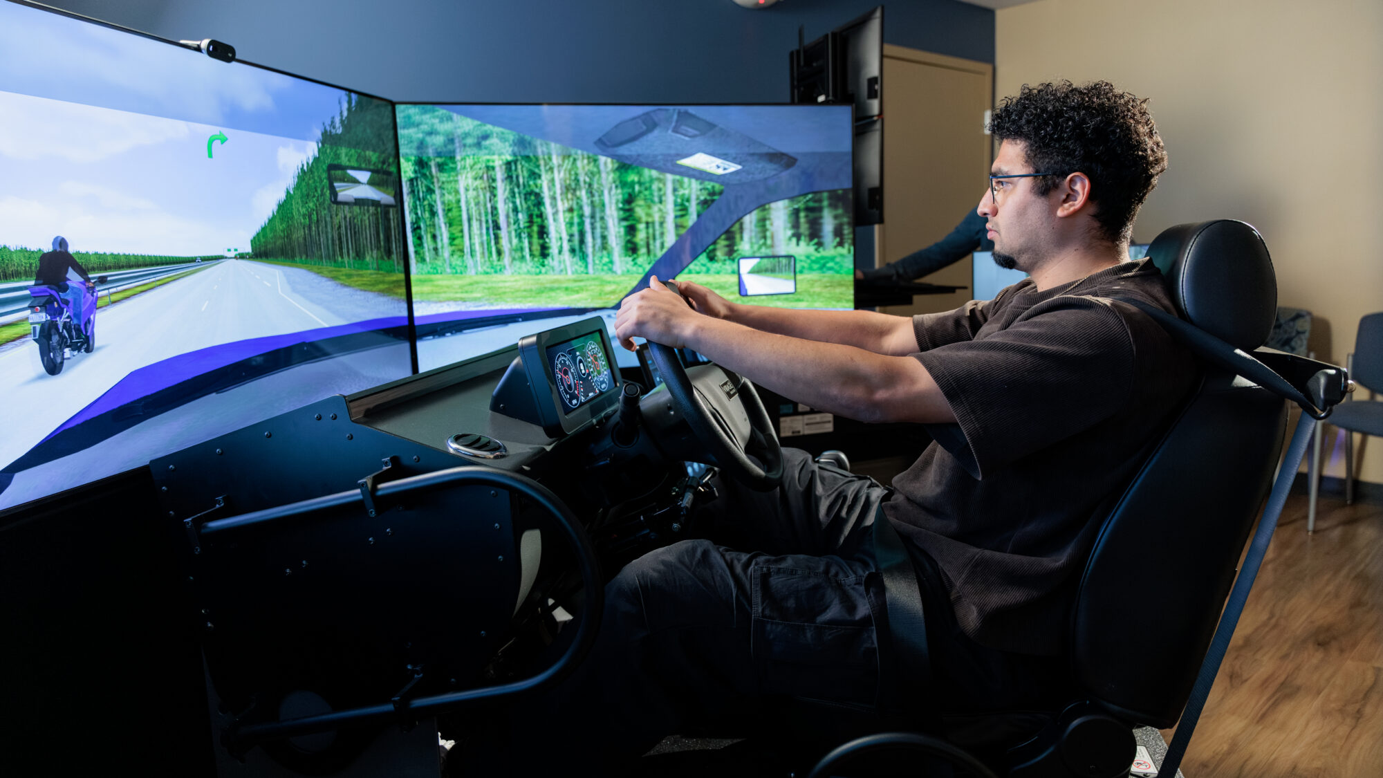 Center for Transitional Neuro-Rehab patient using an indoor simulator to learn to drive again.