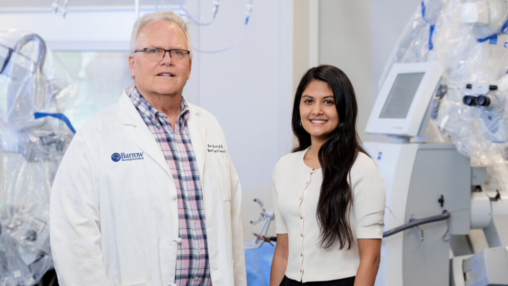 Dr. Preul and Michell Goyal pose for a photo in Dr. Preul's lab