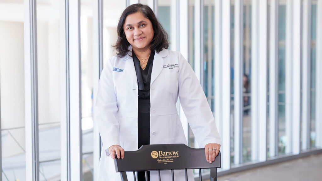 Dr. Ruchira Jha with her chair during the ceremony naming her the Atkinson Chair for Research