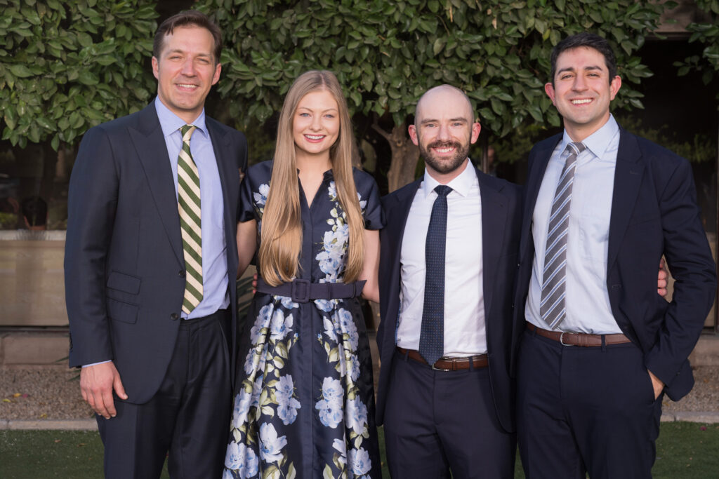 The four graduating neurosurgery residents of 2026 pose for a photo at graduation