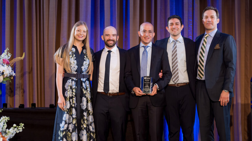 Dr. Nader Sanai is presented with the Teacher of the Year Award from the graduating neurosurgery residents in 2026