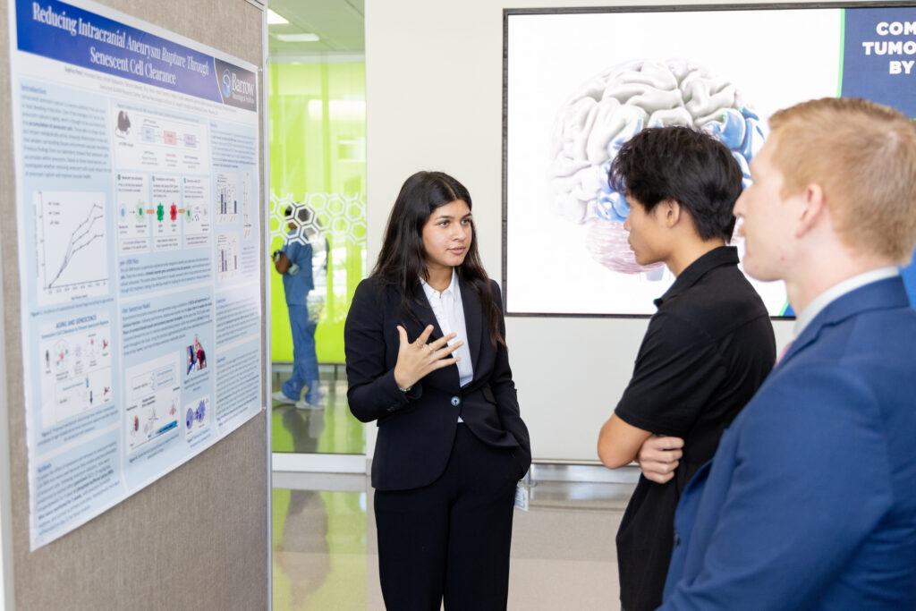 Student presenting poster at High School Internship Symposium