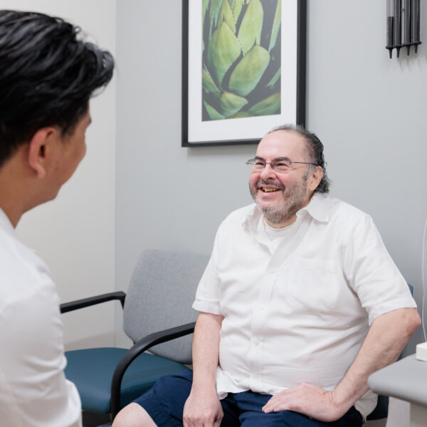 Barrow patient visits with epilepsy surgeon Andrew Yang, MD, in clinic