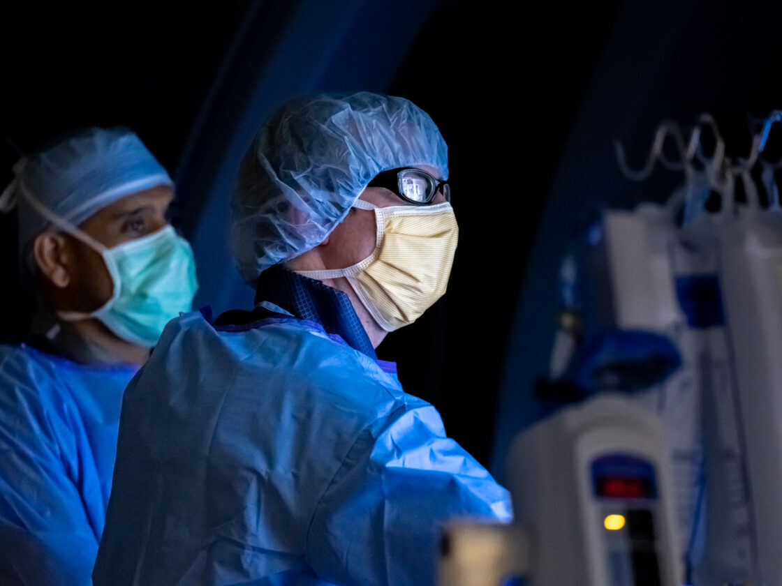 photo of endovascular surgeon Andrew Ducruet performing surgery in an operating room at barrow neurological institute in phoenix arizona