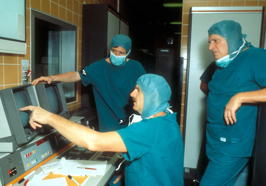 A photo of Barrow neurosurgeons looking at computers