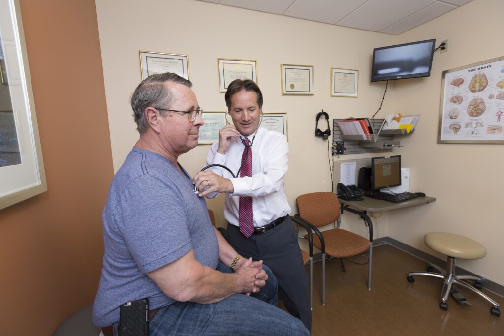 neuro-otologist terry fife examines a patient
