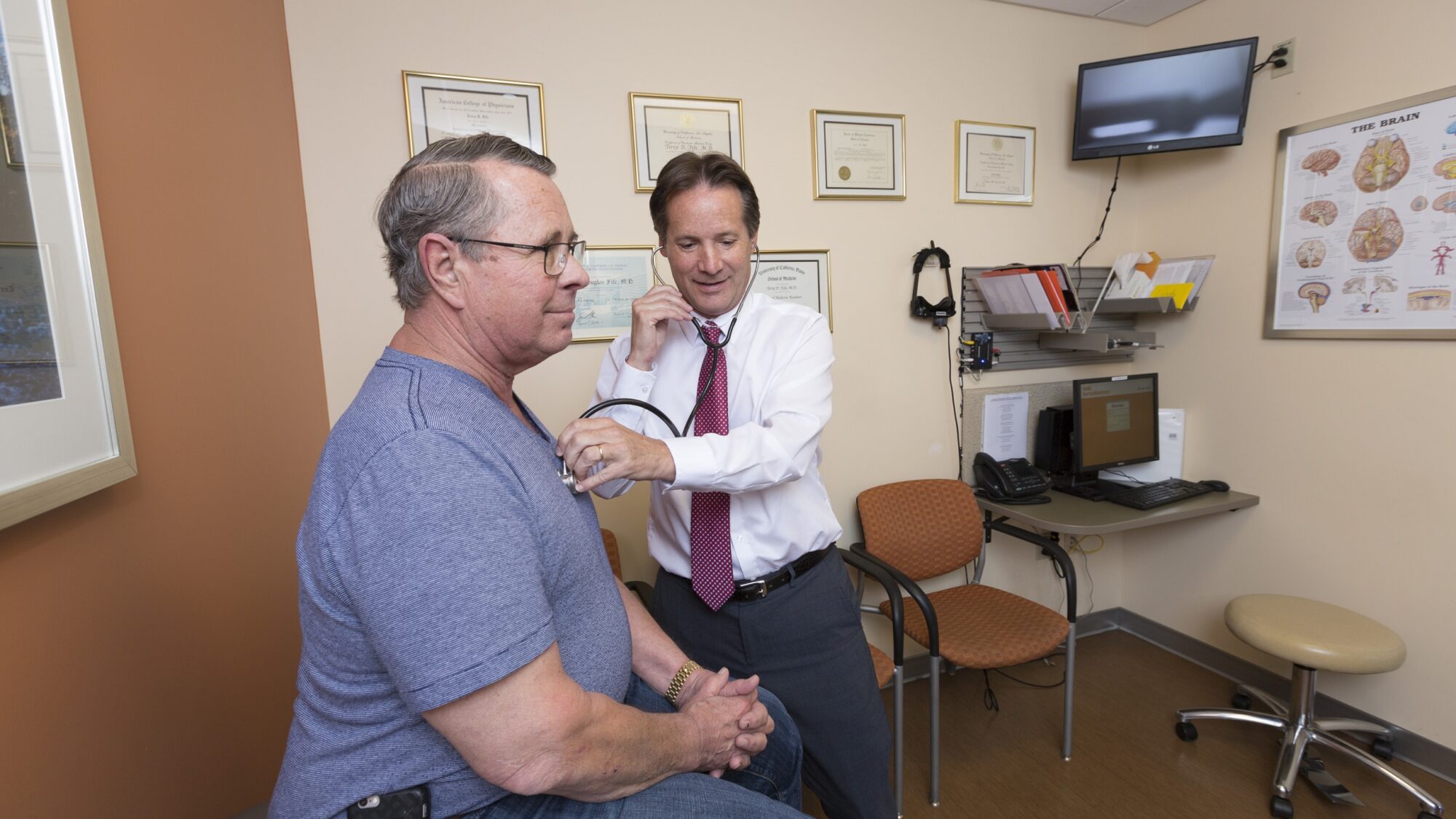 neuro-otologist terry fife examines a patient