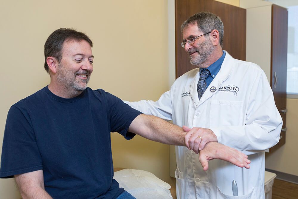 Dr. Shefner checking up an ALS patient