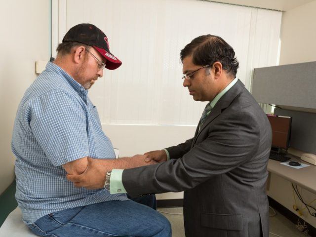 photo of shafeeq ladha performing a neurological exam