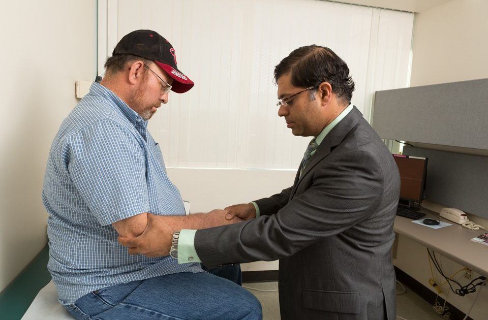 photo of shafeeq ladha performing a neurological exam