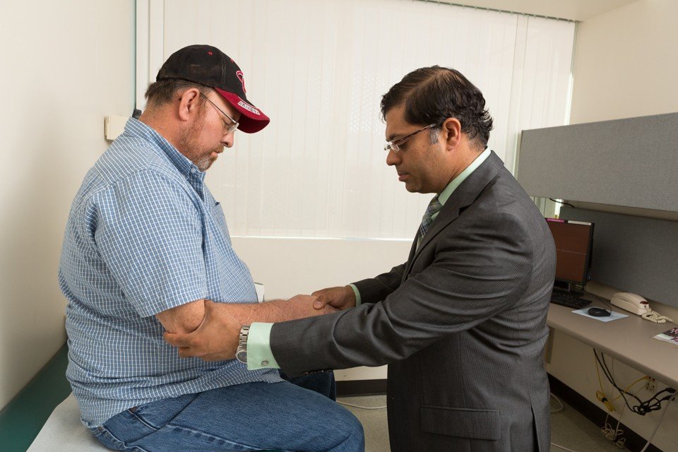 photo of shafeeq ladha performing a neurological exam