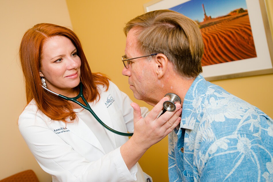 Barrow Alzheimer's Specialist Anna Burke examining a patient