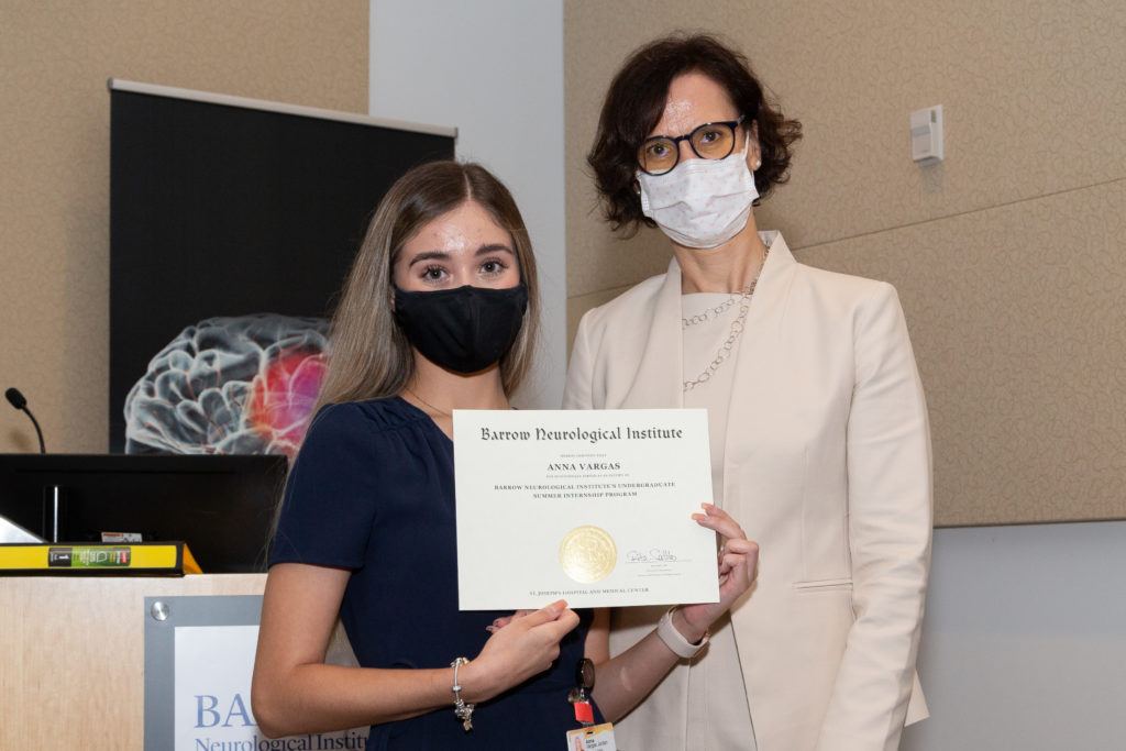 Anna Vargas holding a completion certificate and standing next to Dr. Rita Sattler