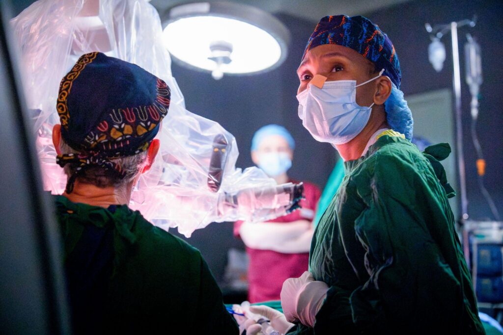 Dr. Happiness Rabiel performs surgery in collaboration with Dr. Lawton in the KCMC OR