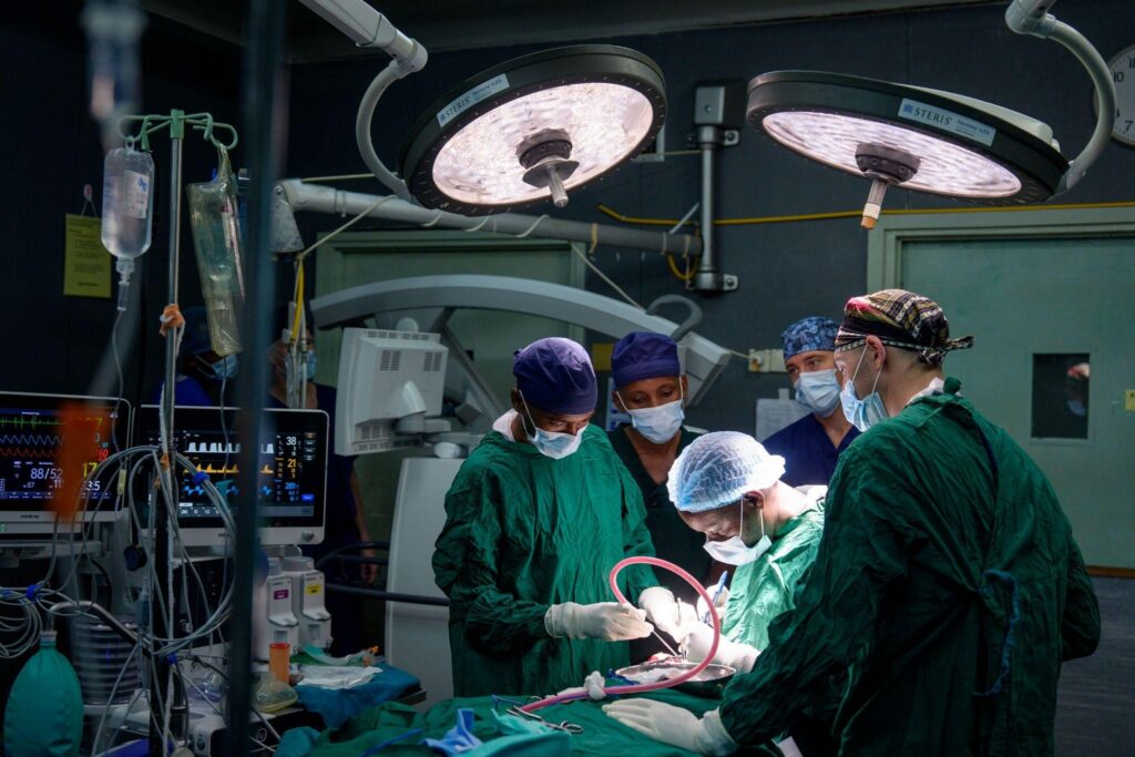 Barrow neurosurgery residents Drs. Cyrus Elahi and Michael Whiote observe and participate in surgery at KCMC in Tanzania.