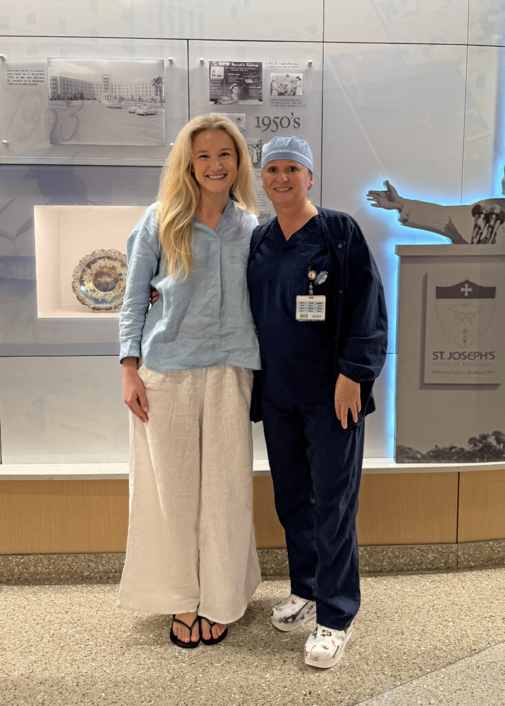 Alexandra and nurse Dorota Serrano in the lobby of St. Joseph's Hospital and Medical Center, home of Barrow Neurological Institute