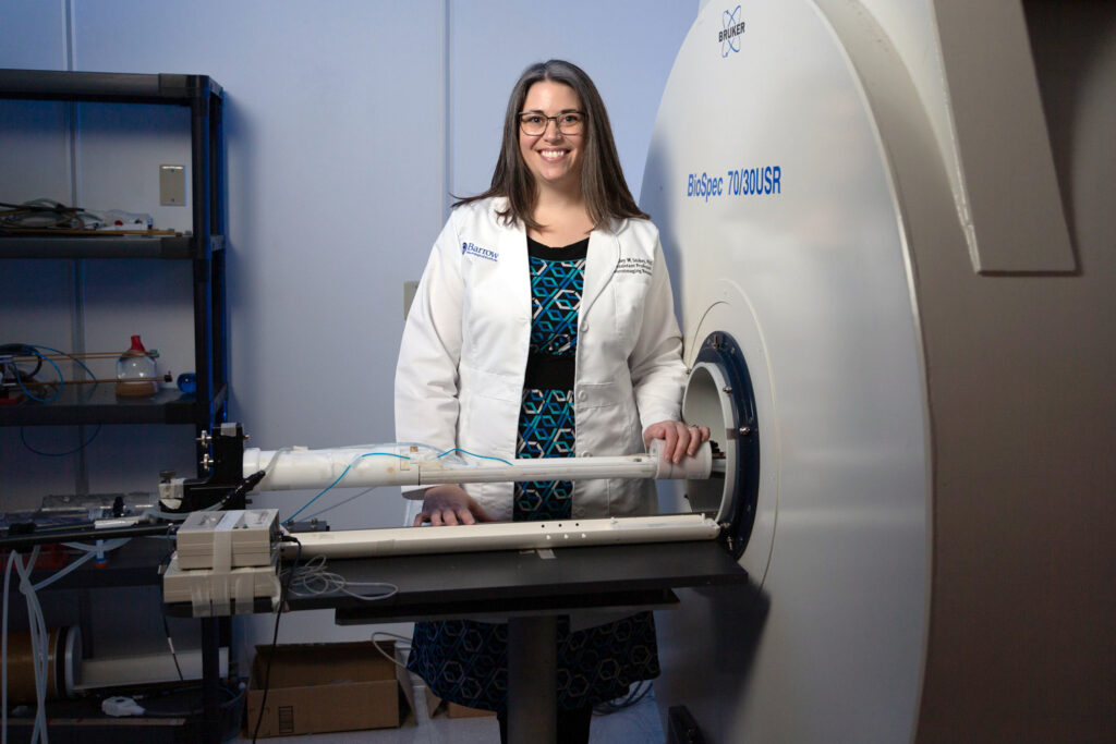 ashley stokes in front of 7t research mri