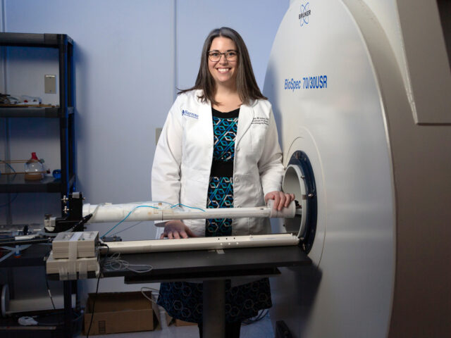 ashley stokes in front of 7t research mri