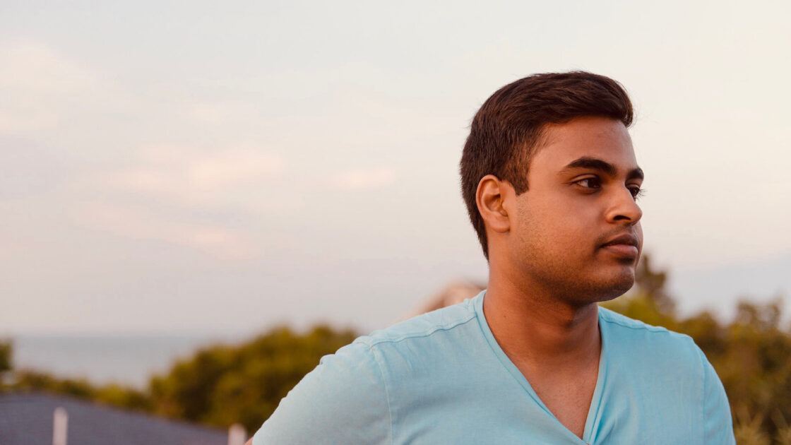 vishnu dantu in front of a sunset and hills