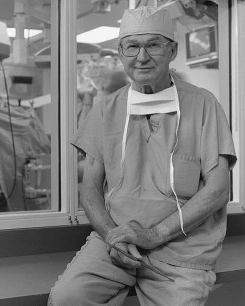A black and white photo of Dr. John Green outside the operating room
