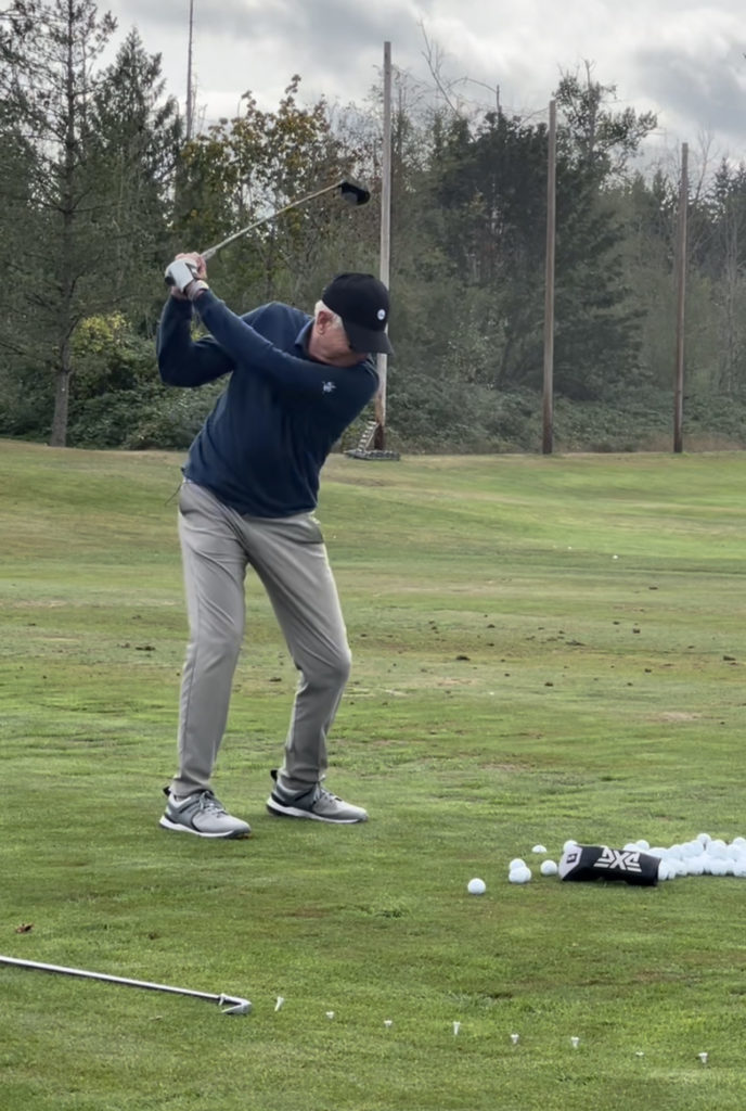 Jim McLean swings a golf club