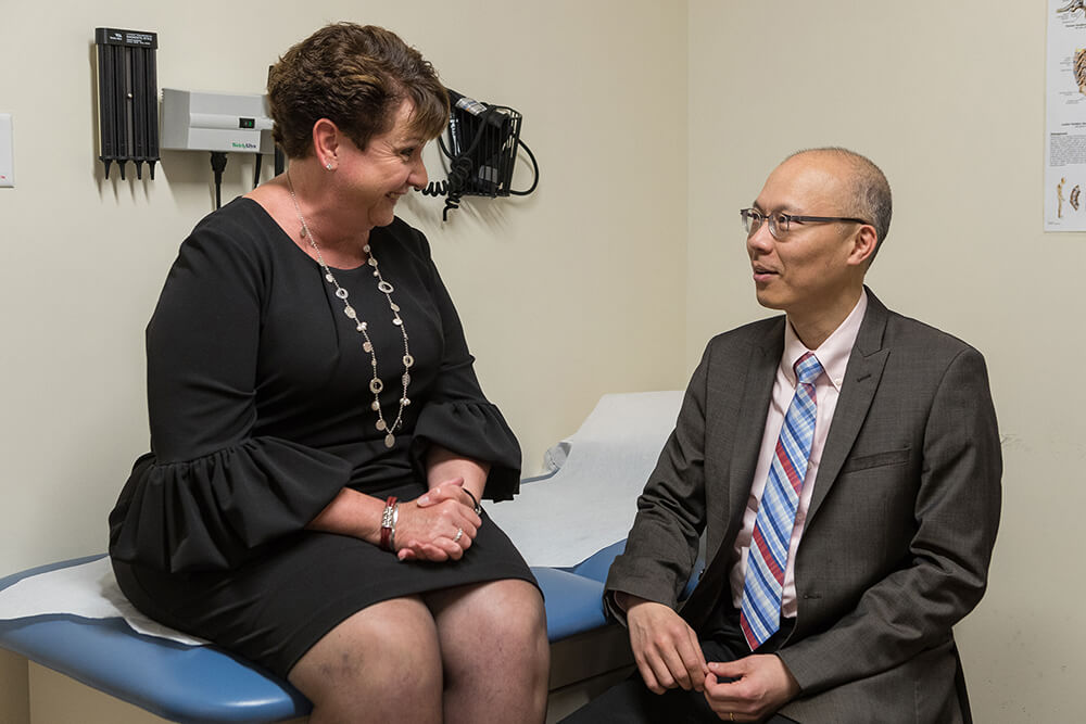 Neuro-endocrinologist Dr. Kevin Yuen discusses adult growth hormone deficiency with patient Patricia Buckley