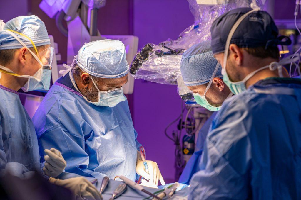 spine surgeon kumar kakarla operates on an adult scoliosis patient