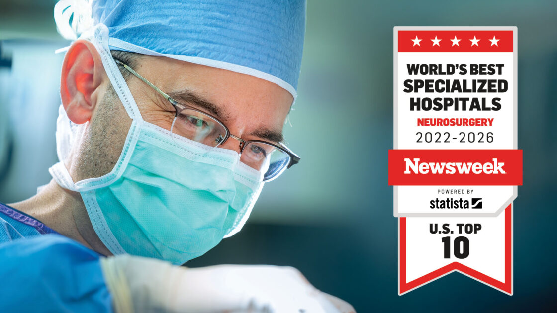 Photo of a neurosurgeon operating, overlaid with the Newsweek badge