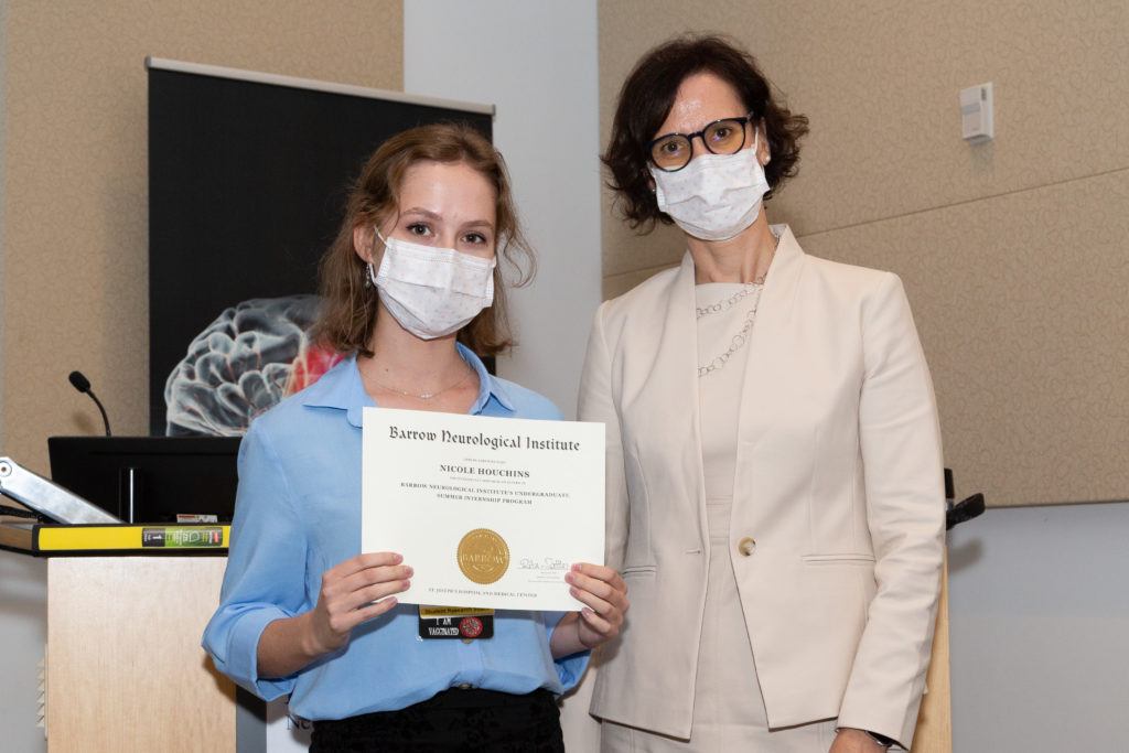Nicole Houchins is pictured holding a completion certificate and standing next to Dr. Rita Sattler