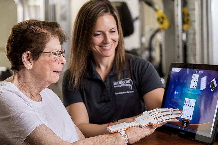 barrow physical therapist working with patient in neuro-rehabilitation