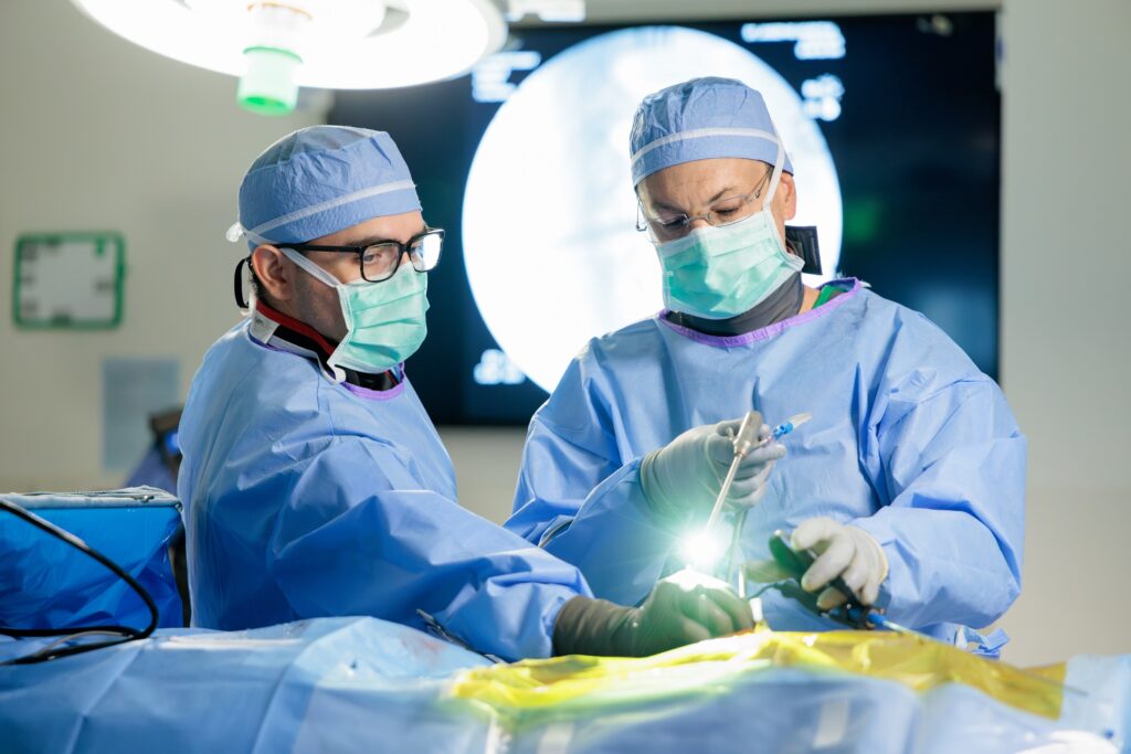 Photo of Dr. Uribe performing an endoscopic spine surgery in the Barrow operating room.