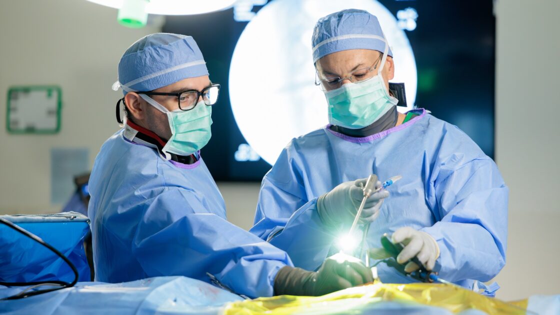 Photo of Dr. Uribe performing an endoscopic spine surgery in the Barrow operating room.
