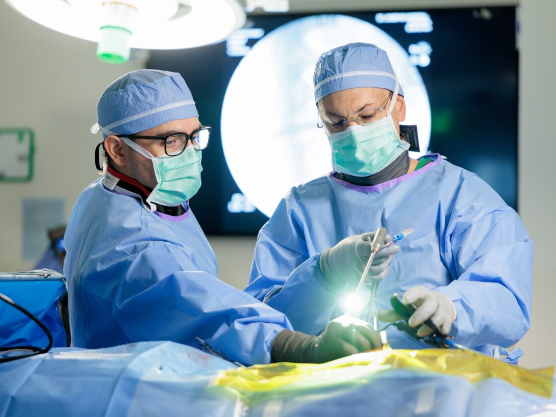 Photo of Dr. Uribe performing an endoscopic spine surgery in the Barrow operating room.