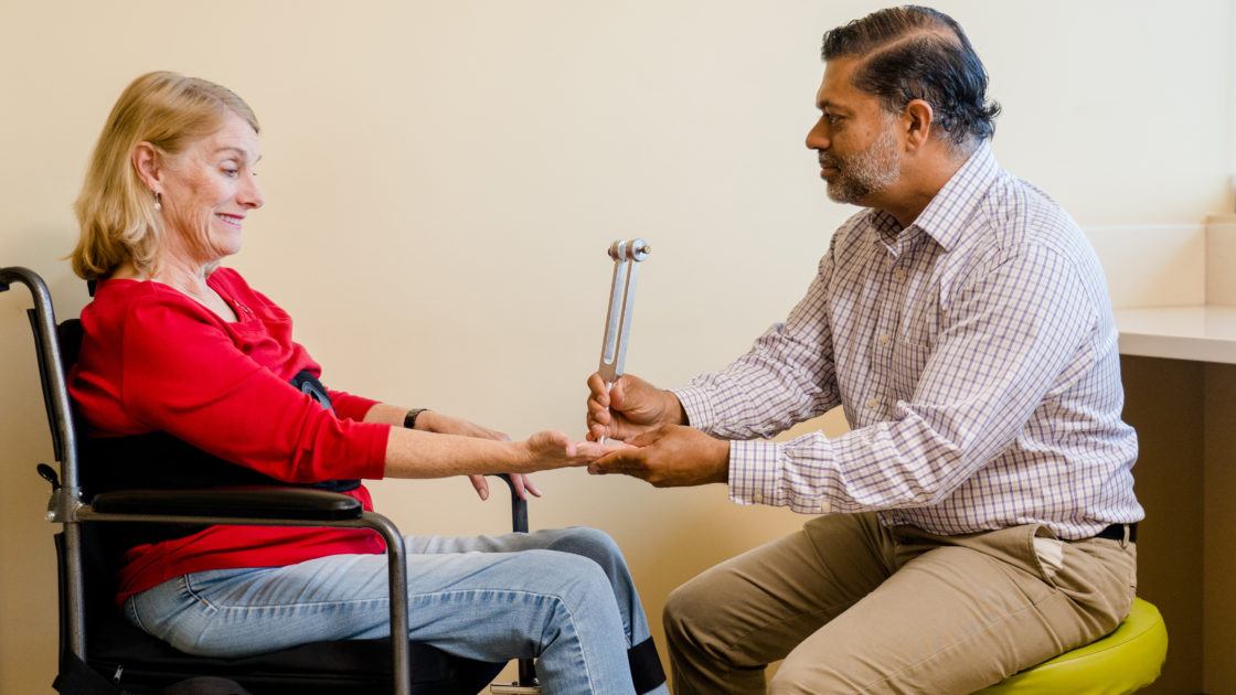 Dr. Shafeeq Ladha examines a patient in the clinic.