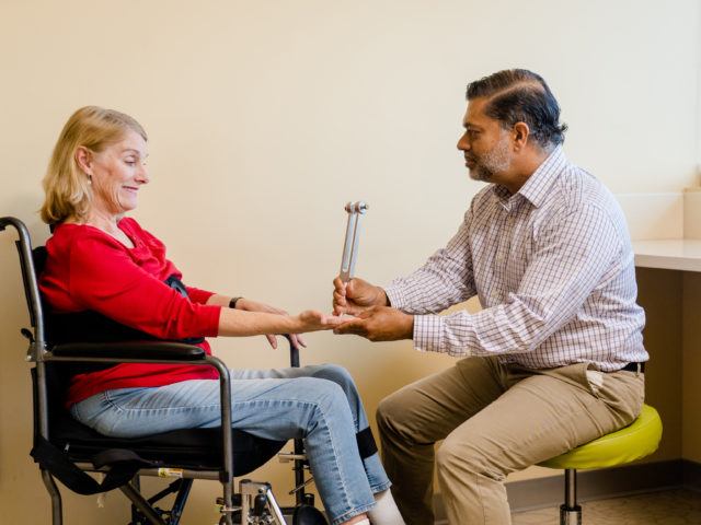 Dr. Shafeeq Ladha examines a patient in the clinic.