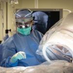 neurosurgeon setting up operation room